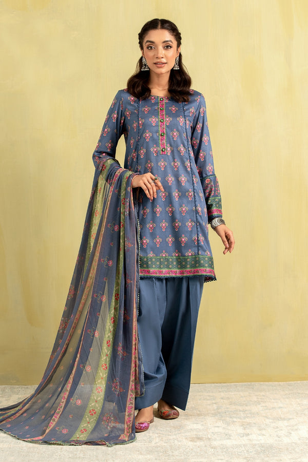 A girl is wearing a blue printed lawn outfit from Ittehad with a chiffon dupatta.